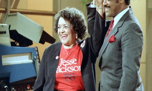 FILE - Democratic presidential hopeful Jesse Jackson clasps hands with his mother, Helen Jackson, during taping of the Phil Donahue show in New York. Jackson told The Associated Press his mother died Monday, Sept. 7, 2015 in her longtime hometown of Greenville, S.C. He says she had been in failing health for some time. She was 92. (AP Photo/Barry Thumma, file)